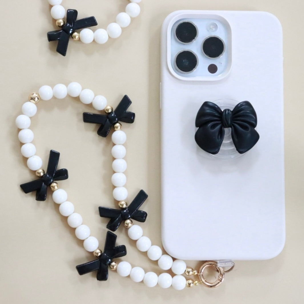 Black bow shaped phone grip for the back of your phone or phone case. The perfect gift for kids, teens & adults.