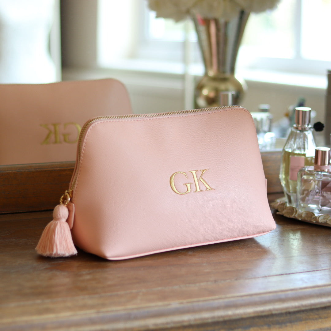 Personalised pink faux leather makeup/clutch bag with gold embroidered monogram initials and matching pink tassel zipper. Custom travel, cosmetics pouch gift for her.